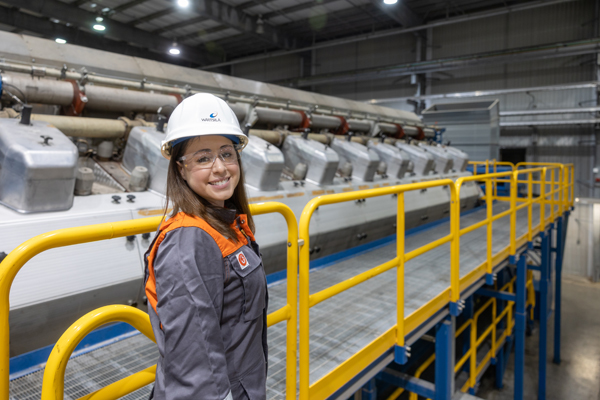Woman working in combustion engine power plant.