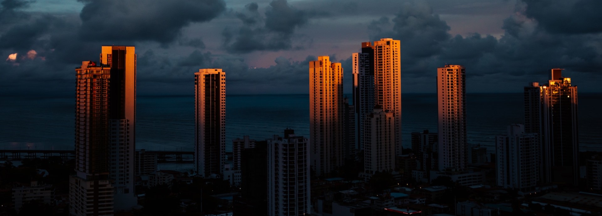 Cityscape as dusk falls. Skyscrapers with the last rays of the setting sun falling on them.