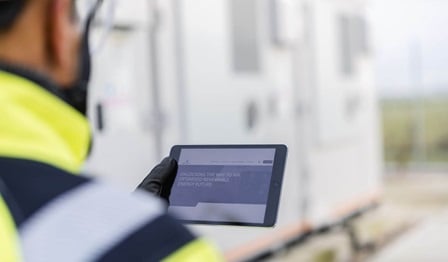 Service team member holding IPad