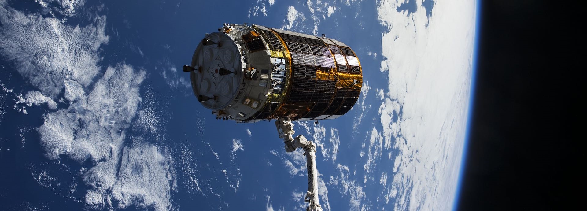 Image of a spacecraft module attached to a 700 m long electro-dynamic tether that will drag the spacecraft towards Earth.