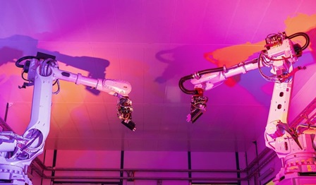 Manufacturing robotics on a pink background
