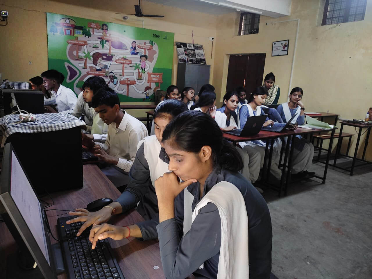 Indian students, girl in front of a computer