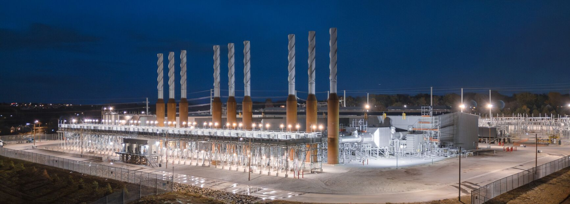 OPPD 156 MW multi-fuel engine power plant in Nebraska featuring nine 18-cylinder Wärtsilä 50DF engines at night