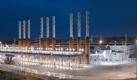 OPPD 156 MW multi-fuel engine power plant in Nebraska featuring nine 18-cylinder Wärtsilä 50DF engines at night