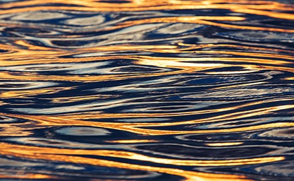Golden-yellow, glittering water