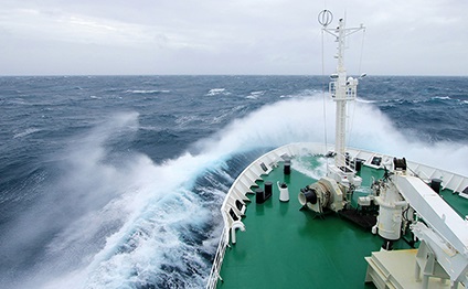 Ship's bow on a high, stormy sea