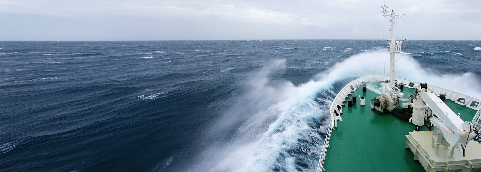 Ship's bow on a high, stormy sea