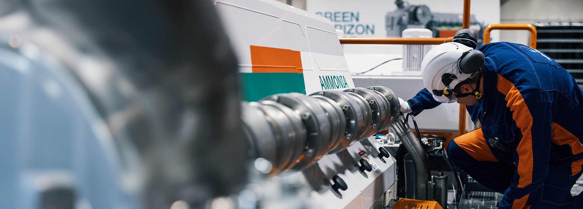 Wärtsilä employee works on an engine
