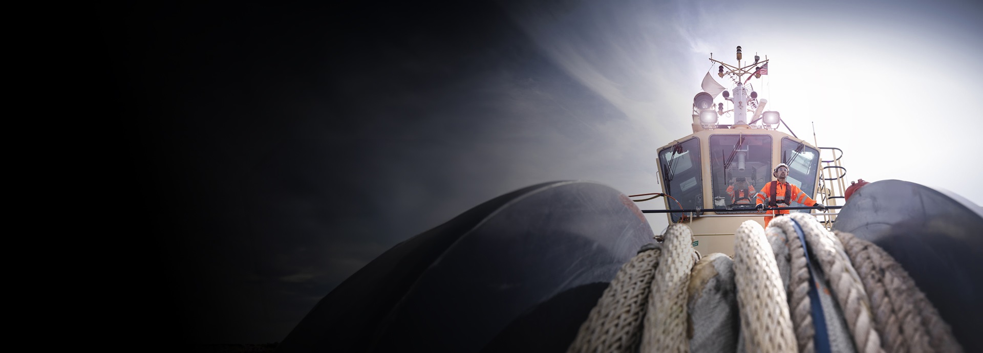 tugboat worker standing on bridge