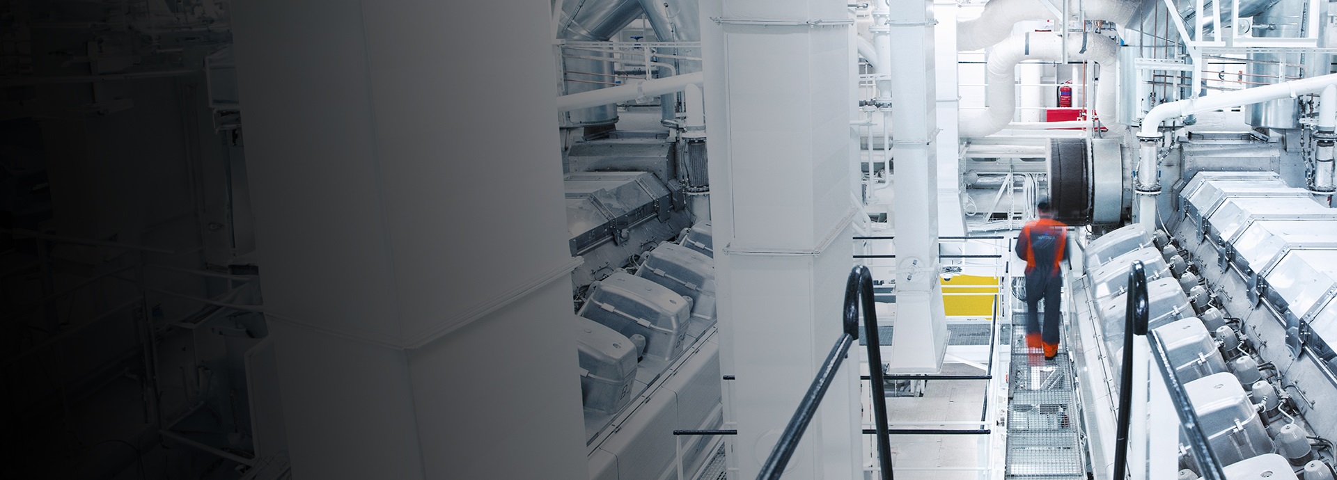 Man walking inside engine room