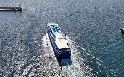 high speed Seajet passenger vessel leaving port of Piraeus to Aegean Cycladic island destination