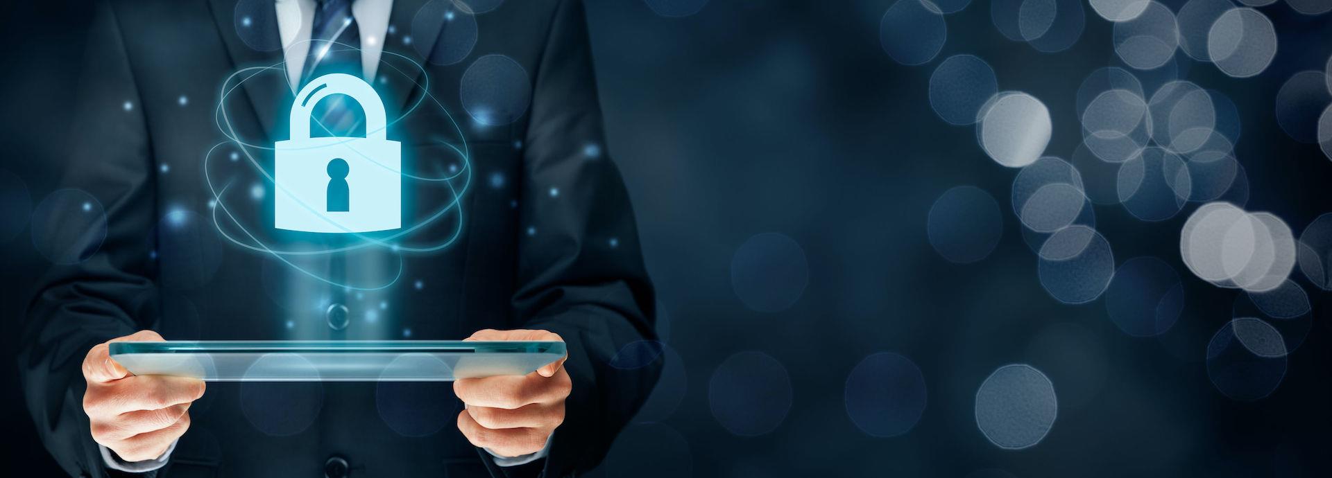 Image showing hands on a computer and a cybersecurity icon