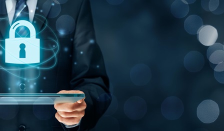 Image showing hands on a computer and a cybersecurity icon