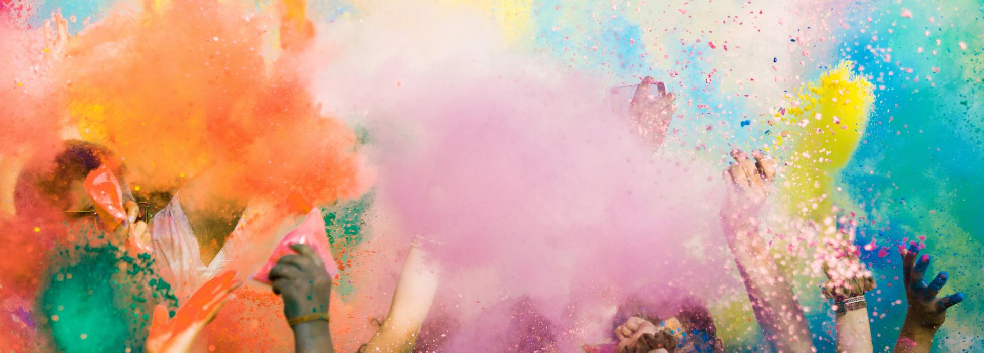 Diverse hands throwing paint bombs