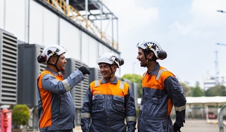 Three field service engineers talking