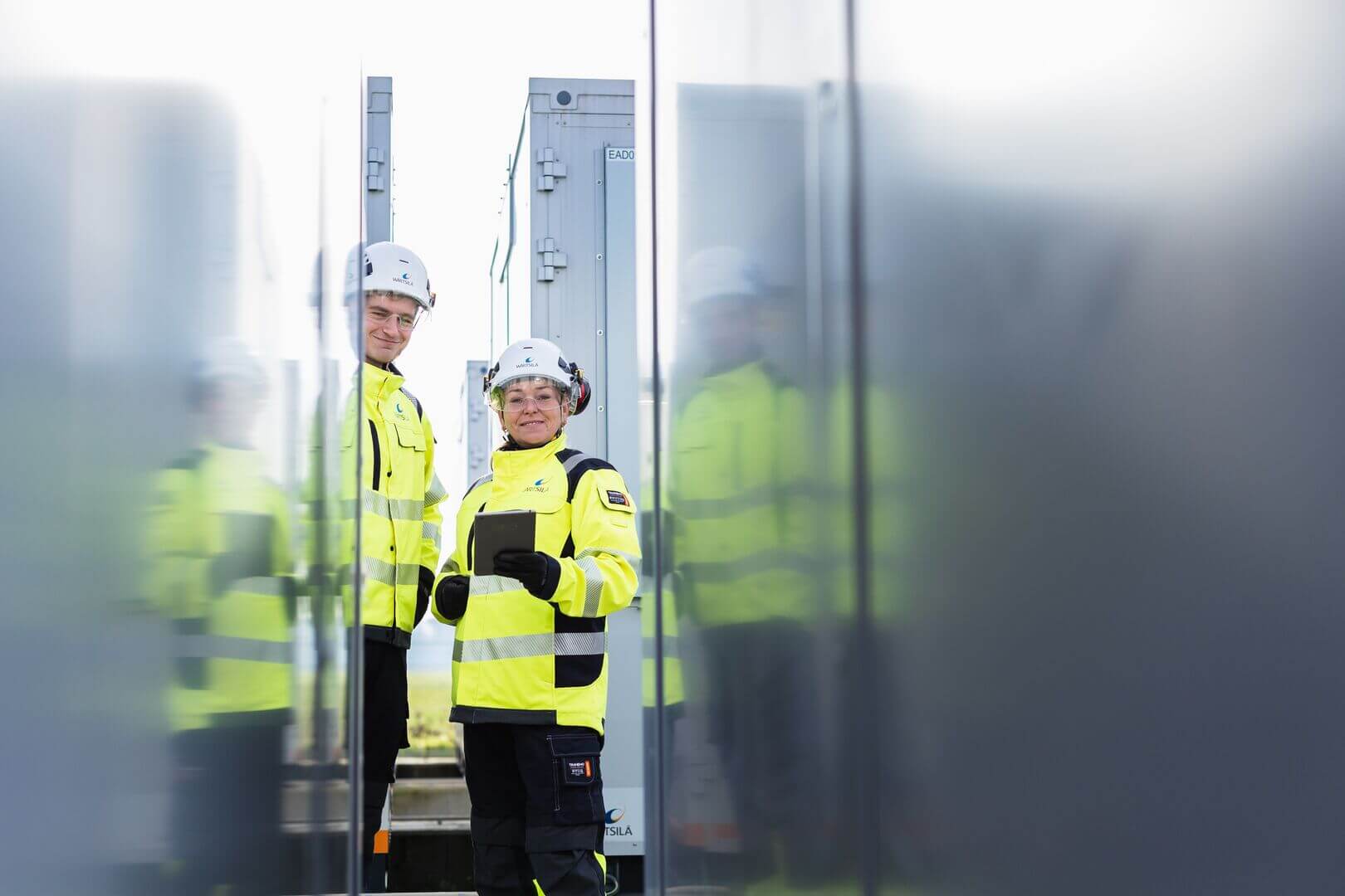 Engineers standing outside plant - Giga storage-6