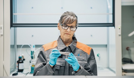 A woman studying sustainable fuels in the Wartsila Fuel Lab in Vaasa