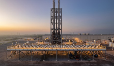 View of power plant at sunset.
