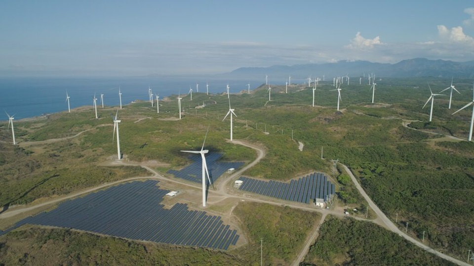 Aerial view of windmills and solar panels