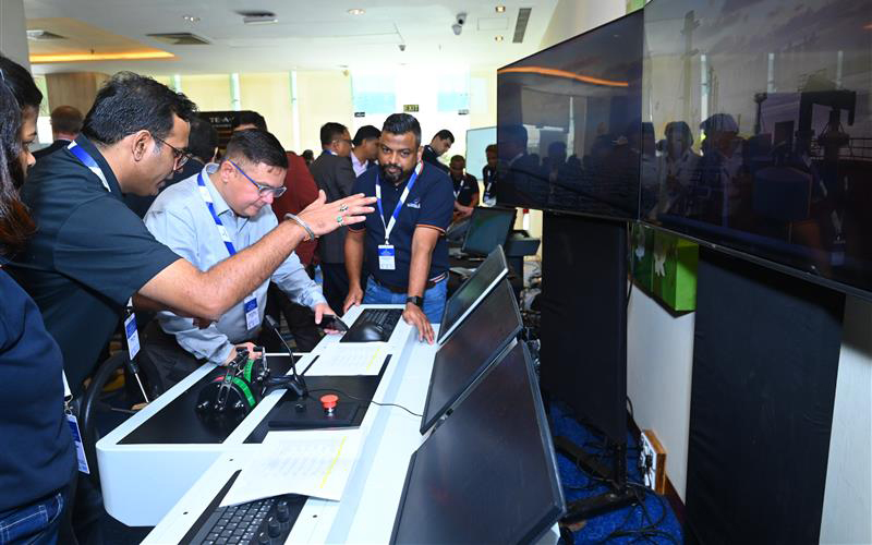 people in front of a bridge simulator