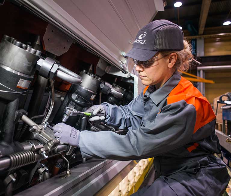 Woman engineer working on engine