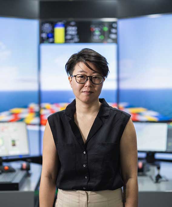 Woman in front of virtual bridge