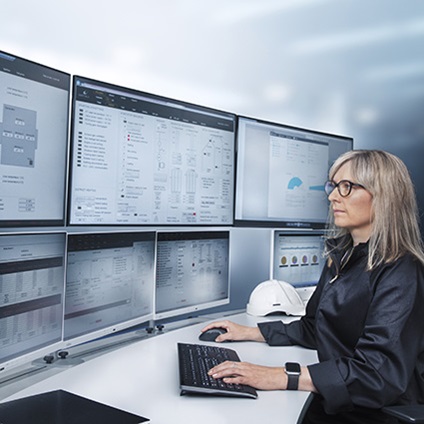 Woman in front of monitors