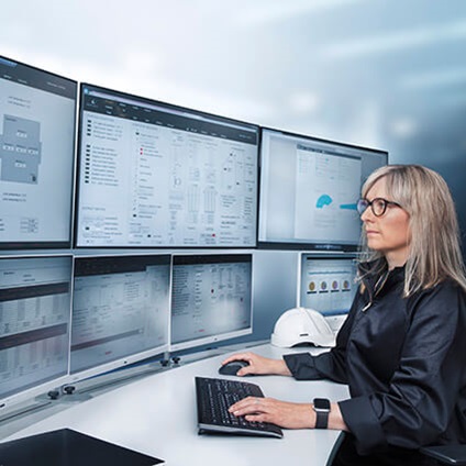 Woman in front of monitors