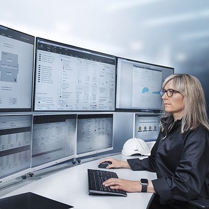 Woman in front of monitors