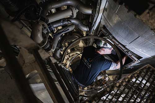 Service engineer inspecting scrubber