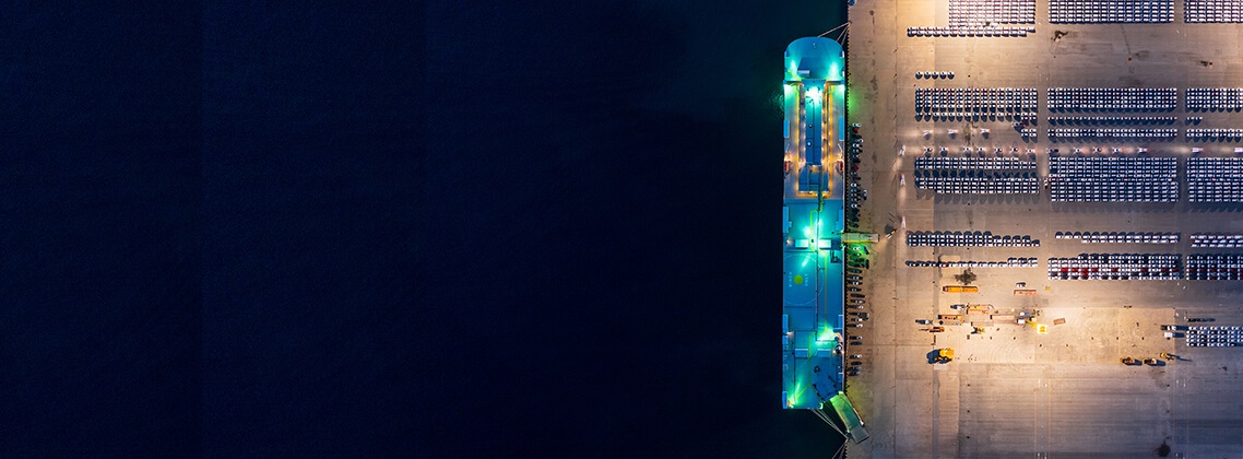 a night-time image of a car carrier vessel
