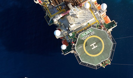 bird's eye view of the Noble Voyager V-rig drillship