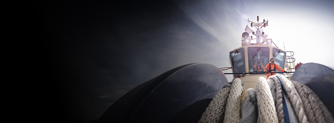 tugboat worker standing on bridge
