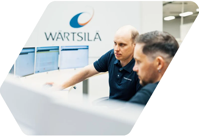 Expertise Centre in Vaasa in STH showing two employees sitting in front of screens