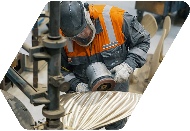 Service employee works on propeller