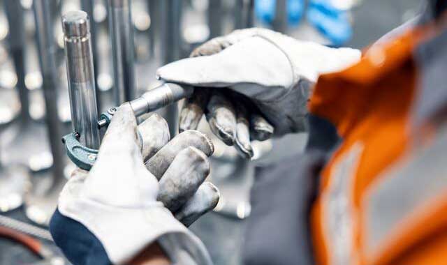 hands from an service employee holding spare part