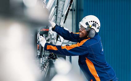 Male factory worker with the Wärtsilä W46TS Engine