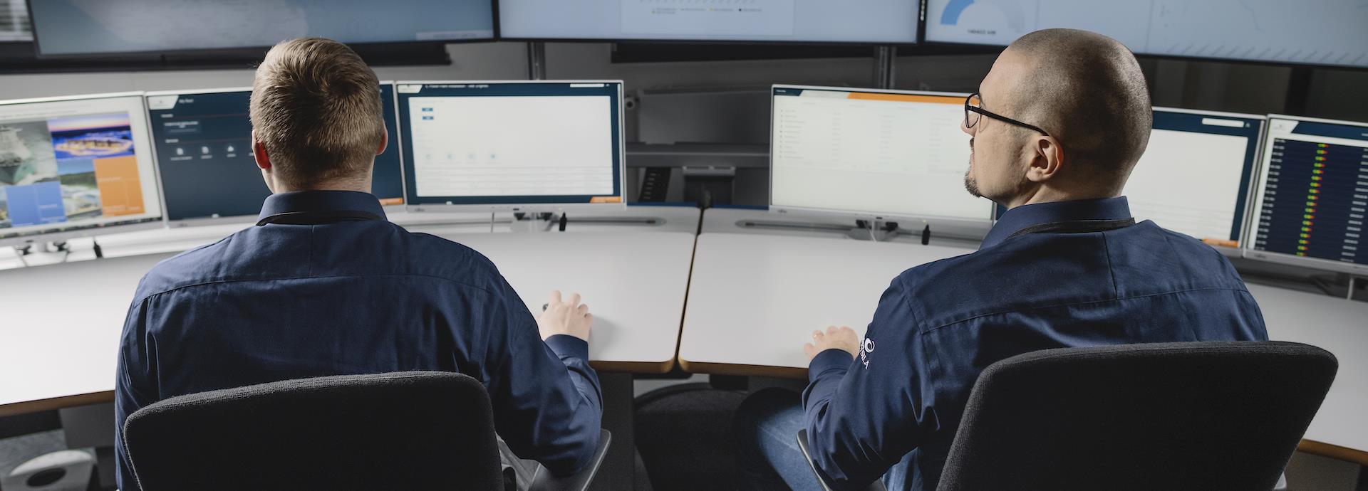 Two Wärtsilä specialists examine operational data provided virtually.