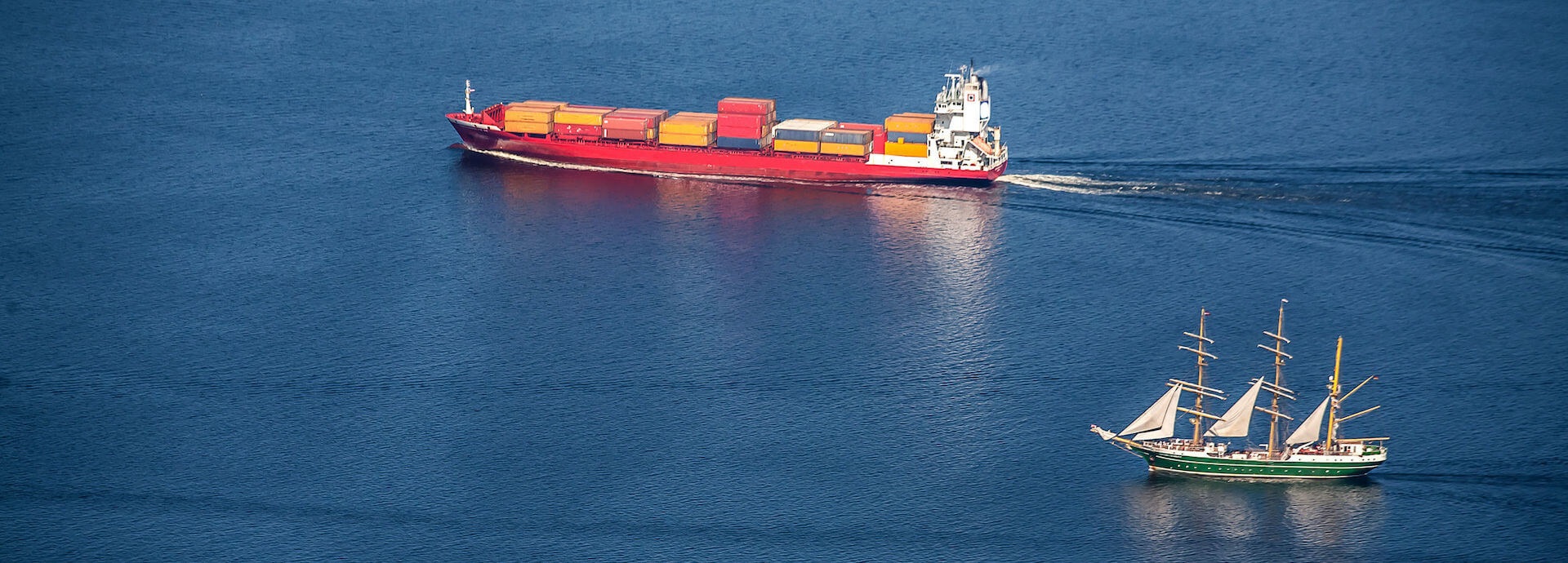 Cargo ship and tall ship in the Baltic Sea